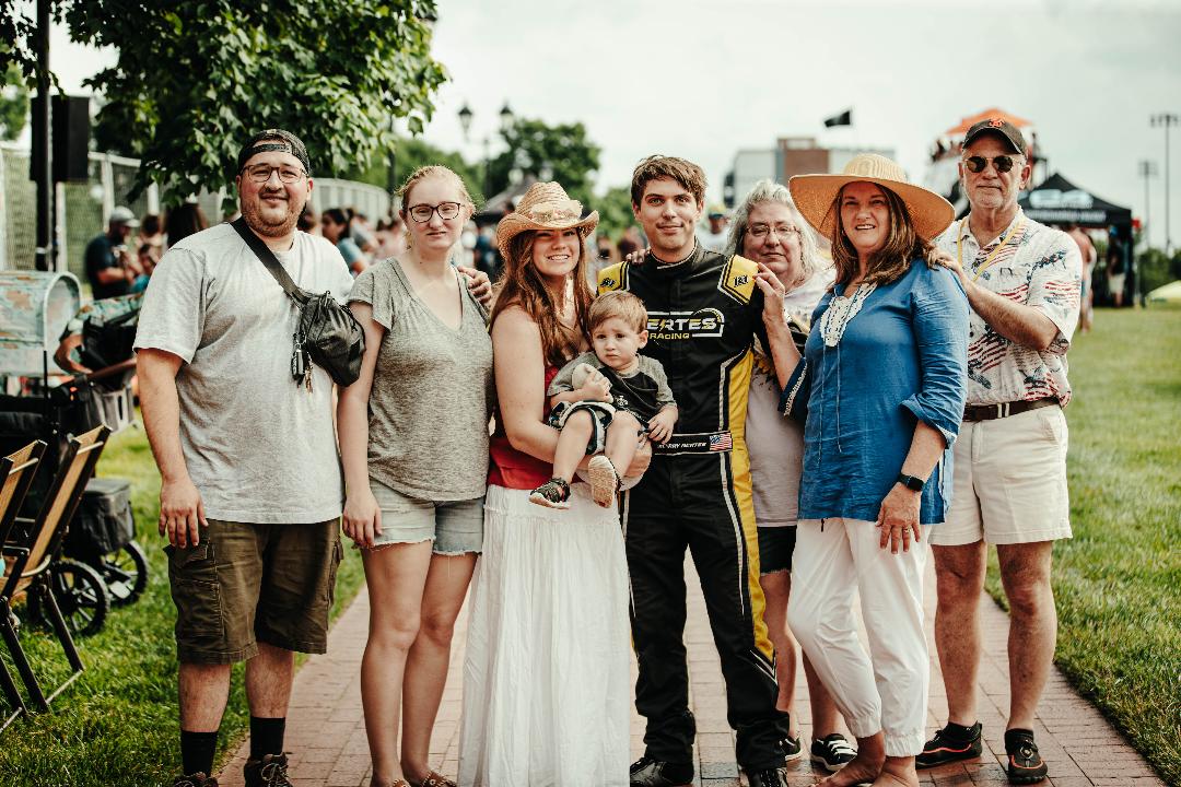Zachary with family at a race event